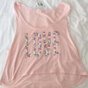 XL LIGHT PINK CROP TOP WITH FLORAL “LOVE” DESIGN.